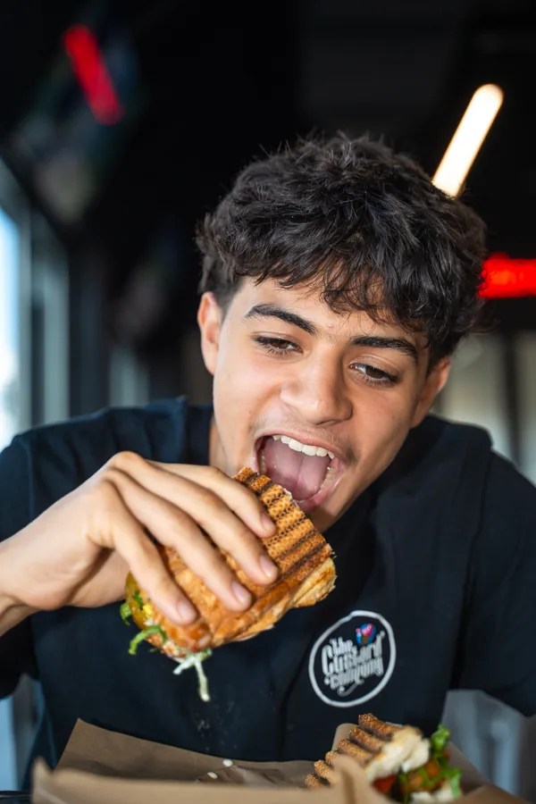 Taking a bite of a sandwich