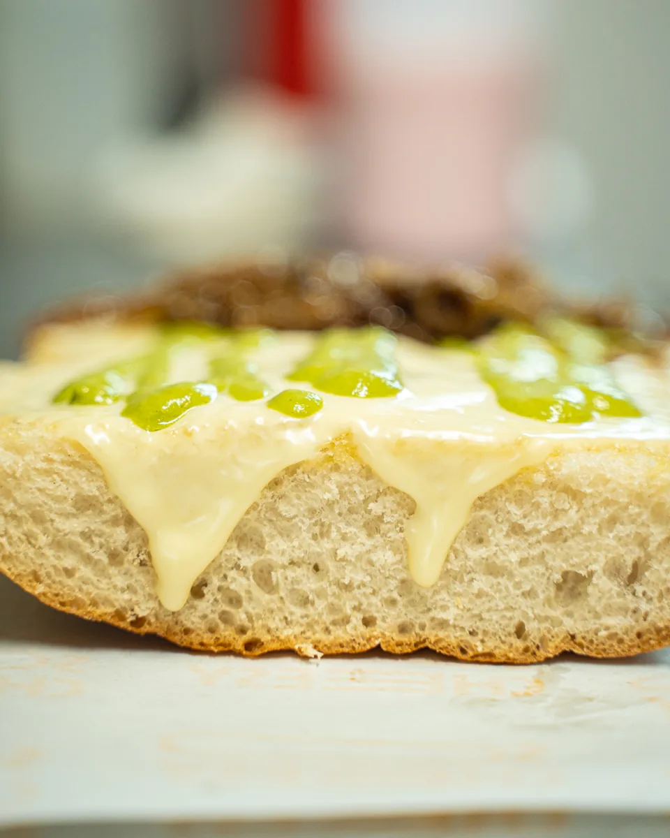 Cheese dripping down the ciabatta